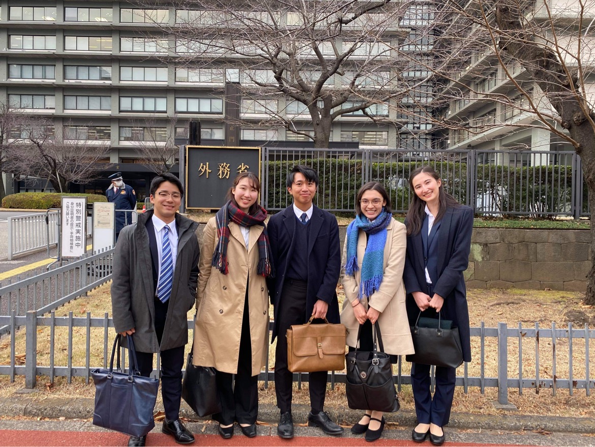 The author, seen on the far right, stands with peers after presenting a proposal on LAWS at the Ministry of Foreign Affairs in Japan.