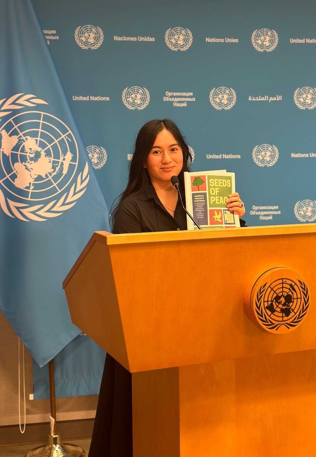 A person standing at a podium holding a book

AI-generated content may be incorrect., Picture